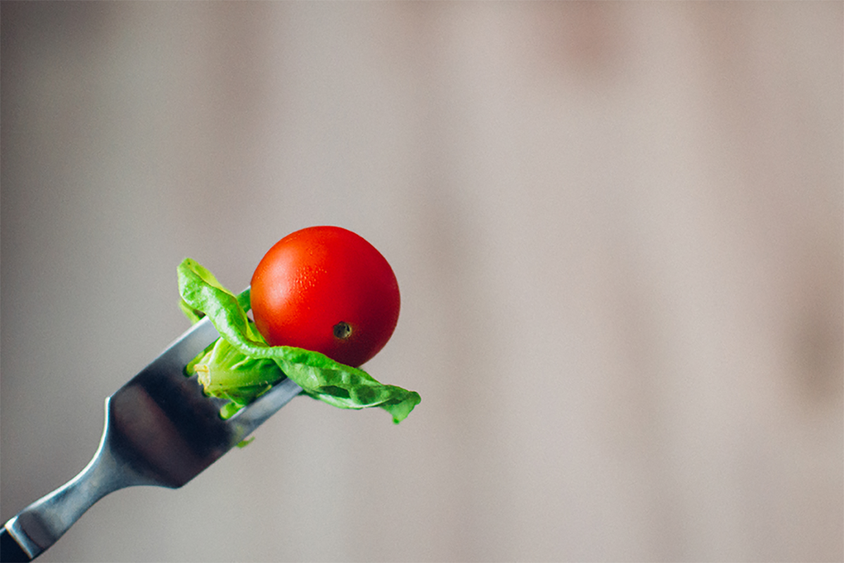 tomato and lettuce on a fork