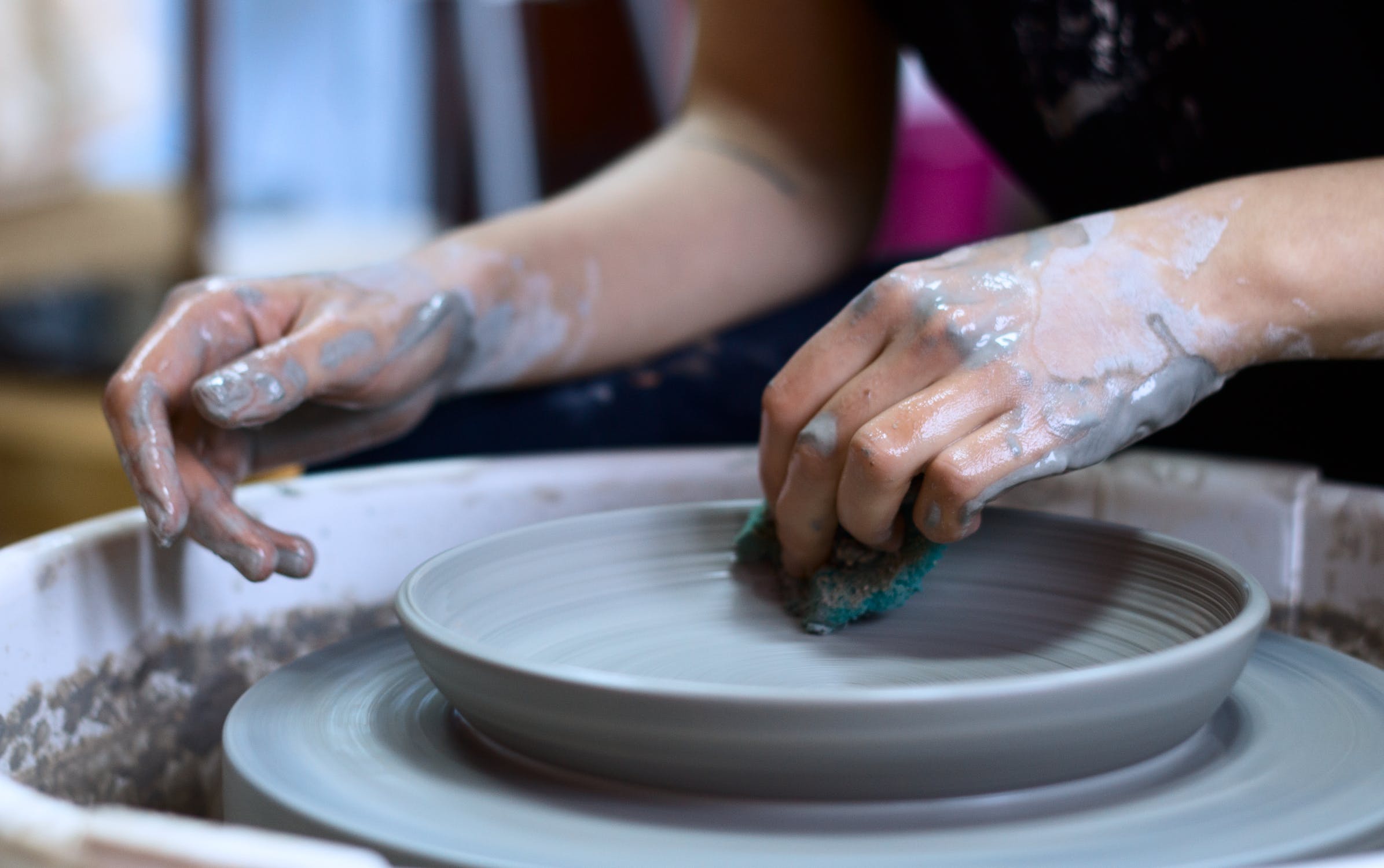 throwing a plate on a pottery wheel