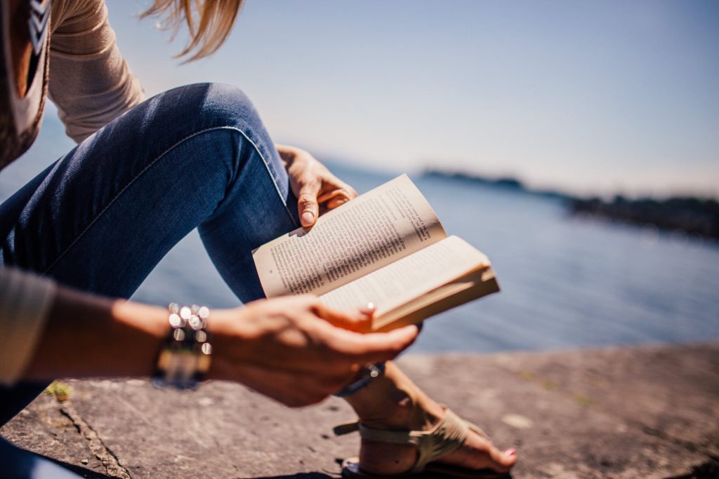 resting by reading near the ocean